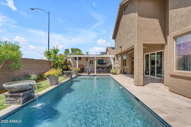 view of pool with a patio, fence, outdoor dry bar, and a fenced in pool