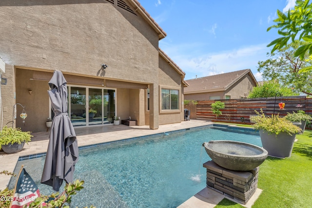 view of swimming pool featuring a fenced in pool, a fenced backyard, and a patio