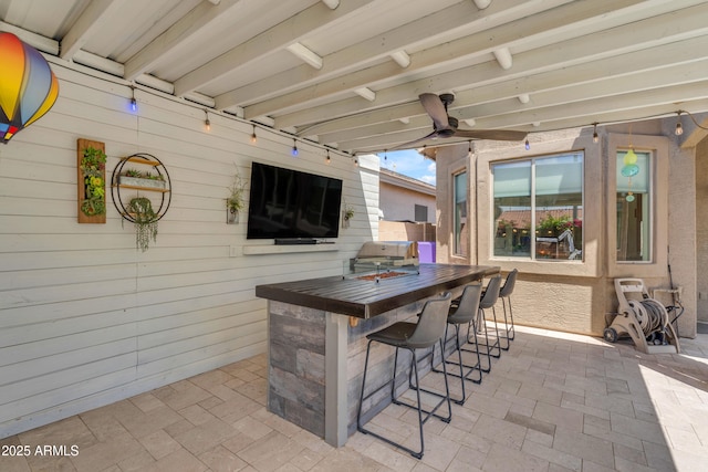 view of patio / terrace featuring outdoor dry bar