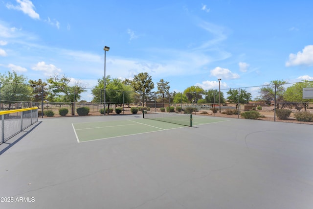 view of sport court featuring fence and community basketball court