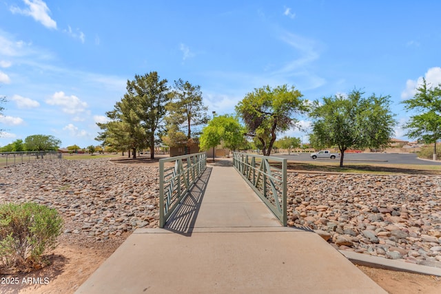 surrounding community with fence and a gate