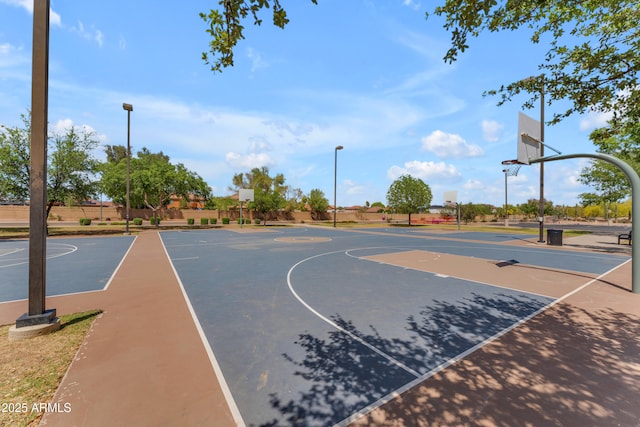 view of basketball court with fence and community basketball court