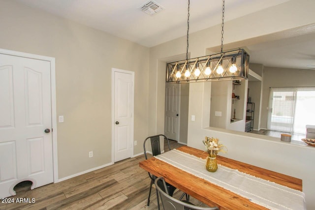 dining space featuring hardwood / wood-style floors