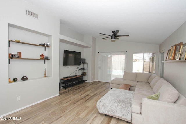 living room featuring light wood-type flooring, ceiling fan, and lofted ceiling