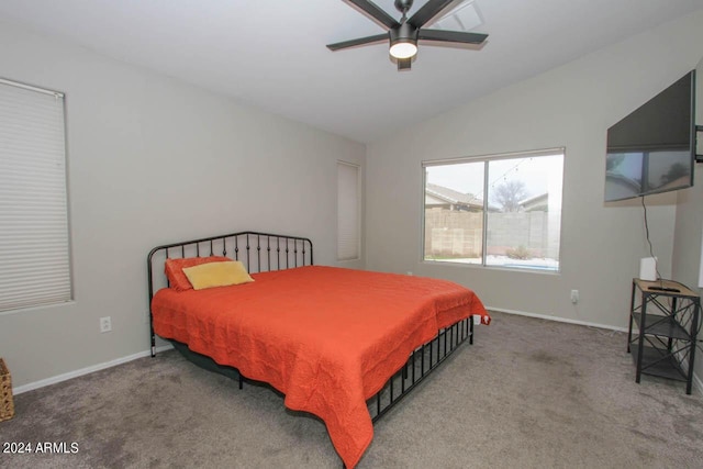 bedroom with ceiling fan, carpet flooring, and vaulted ceiling