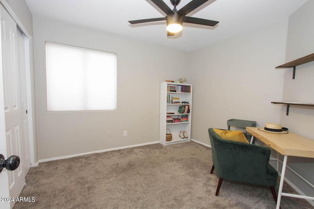 office area featuring ceiling fan and light carpet