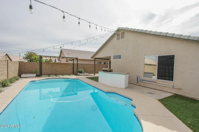 view of pool featuring a patio area