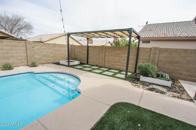 view of pool featuring a pergola and a patio