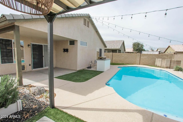 view of swimming pool featuring a patio