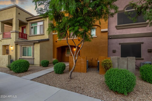 exterior space with a balcony and central AC