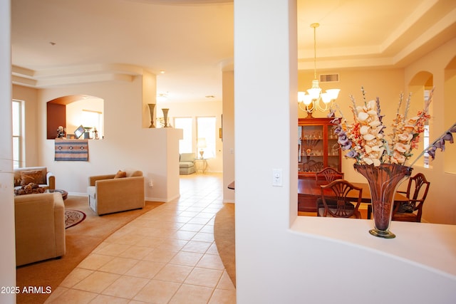 7413 E Russet Sky Dr, Scottsdale, AZ 85266 - corridor featuring light tile patterned flooring, a chandelier, and arched walkways