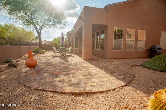 7413 E Russet Sky Dr, Scottsdale, AZ 85266 - fenced backyard with a grill, outdoor dining area, and a patio