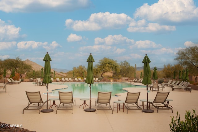 7413 E Russet Sky Dr, Scottsdale, AZ 85266 - community pool with a mountain view and a patio area
