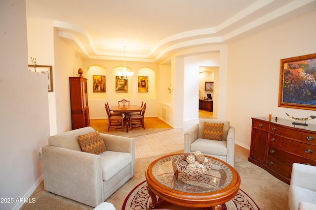 7413 E Russet Sky Dr, Scottsdale, AZ 85266 - living area with a chandelier, a raised ceiling, and baseboards
