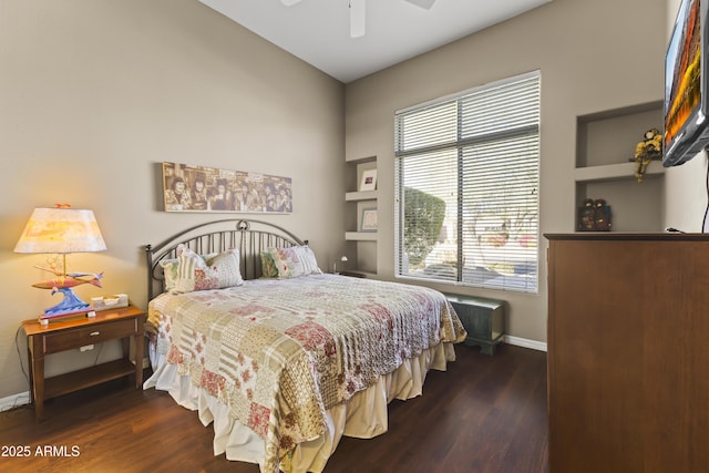 bedroom with dark wood-type flooring and ceiling fan