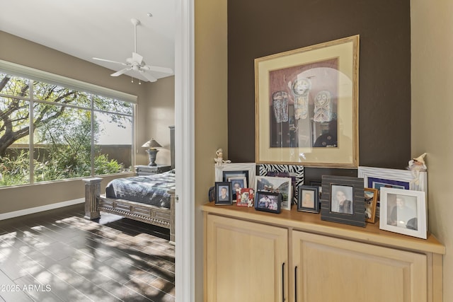 bedroom with dark wood-type flooring and ceiling fan