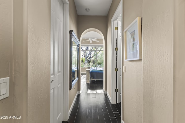 corridor with dark wood-type flooring