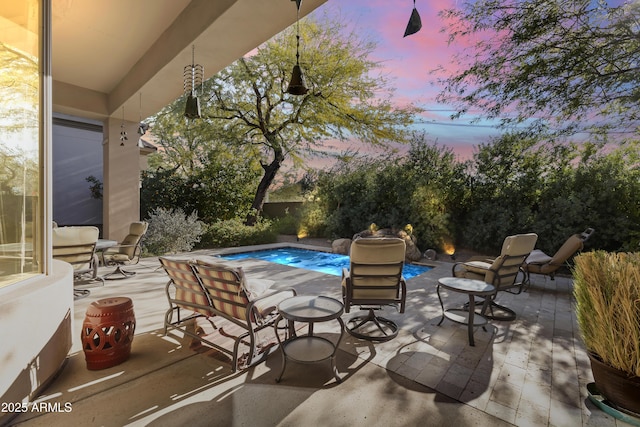 view of patio terrace at dusk