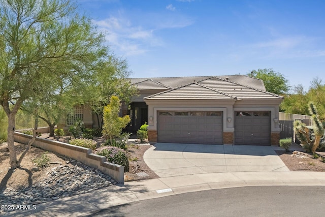 11008 N 119th Pl, Scottsdale, AZ 85259 - view of front facade featuring a tiled roof, a garage, concrete driveway, and brick siding