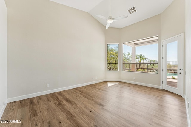 11008 N 119th Pl, Scottsdale, AZ 85259 - unfurnished room with wood finished floors, lofted ceiling, and ceiling fan