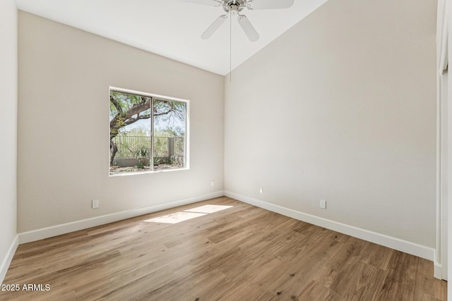 11008 N 119th Pl, Scottsdale, AZ 85259 - spare room featuring ceiling fan, light wood-style floors, and lofted ceiling