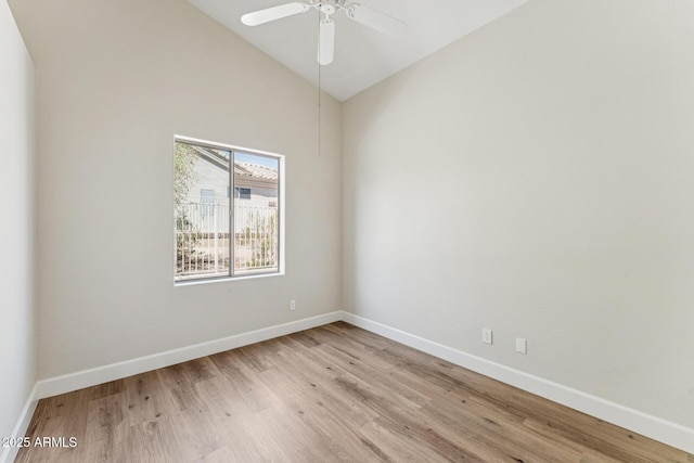 11008 N 119th Pl, Scottsdale, AZ 85259 - spare room featuring light wood-style floors, lofted ceiling, and ceiling fan