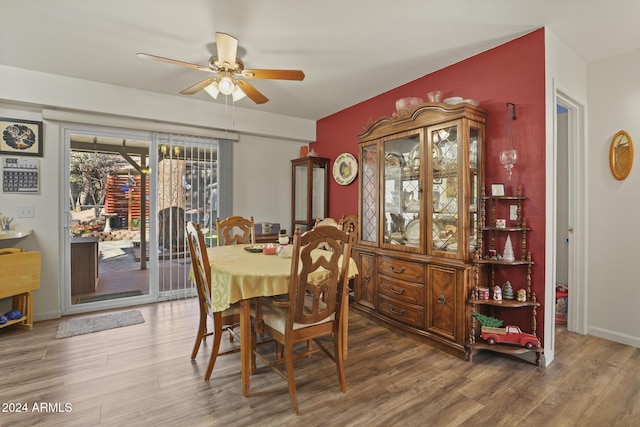 dining room with wood-type flooring and ceiling fan