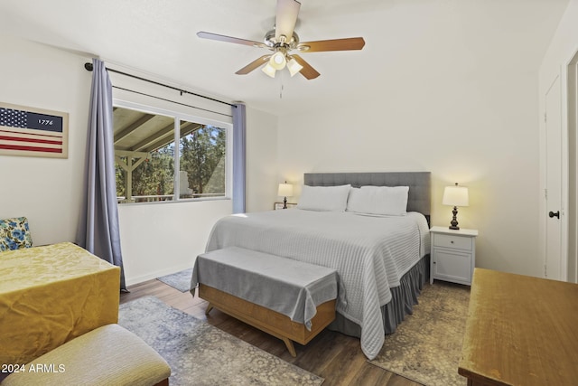 bedroom featuring ceiling fan and dark wood-type flooring