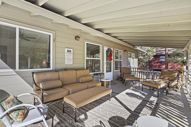 wooden terrace featuring an outdoor living space