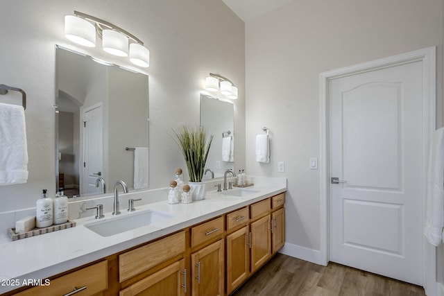 bathroom with vanity and hardwood / wood-style floors