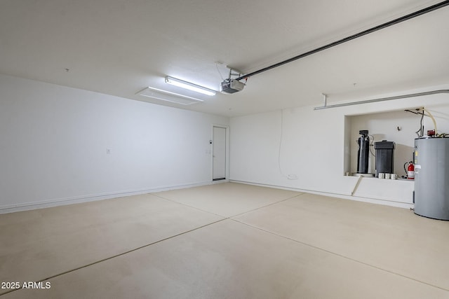 garage featuring a garage door opener and water heater