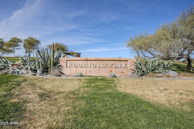 community / neighborhood sign with a lawn