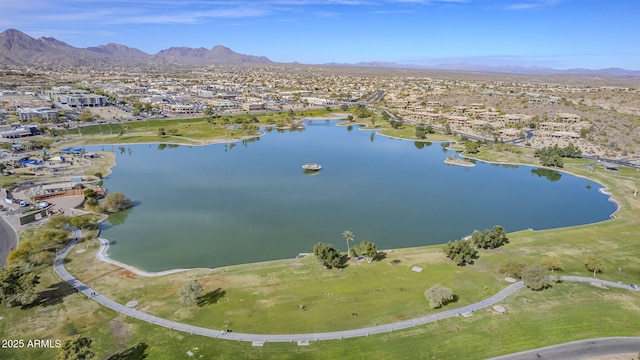 birds eye view of property with a water and mountain view