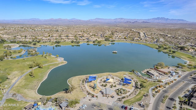 drone / aerial view with a water and mountain view