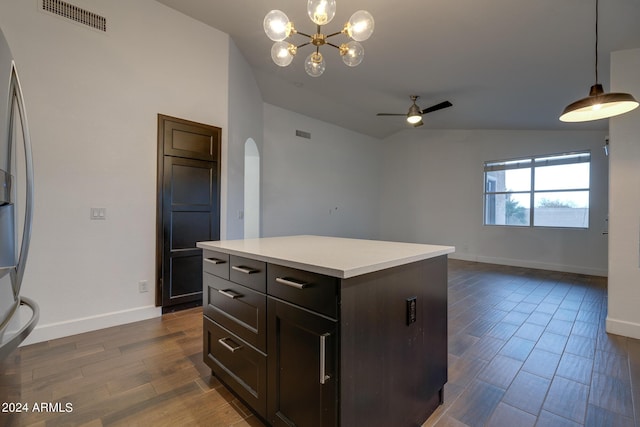 2203 E Crest Ln, Phoenix, AZ 85024 - kitchen with lofted ceiling, arched walkways, stainless steel fridge, a ceiling fan, and light countertops