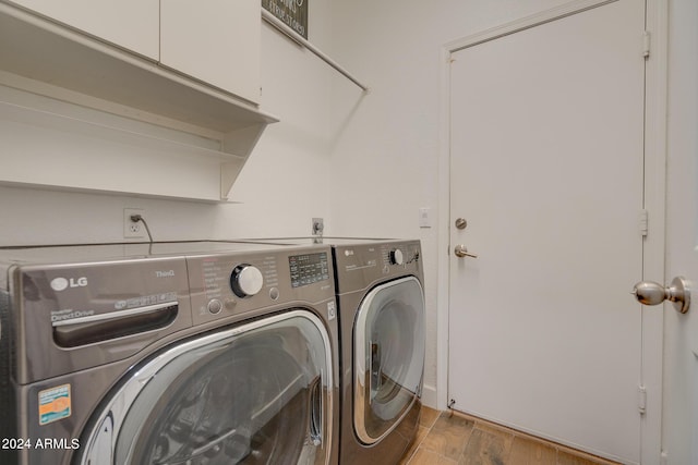2203 E Crest Ln, Phoenix, AZ 85024 - laundry area with washing machine and clothes dryer and wood finished floors