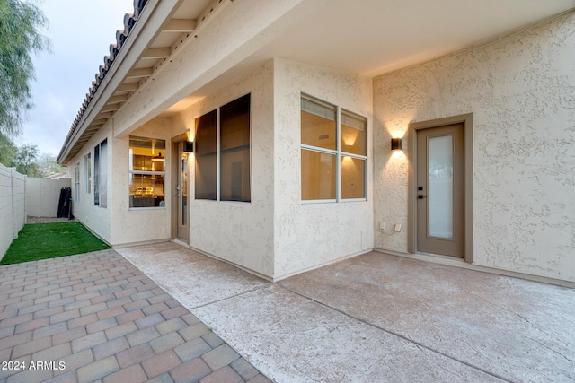2203 E Crest Ln, Phoenix, AZ 85024 - doorway to property featuring stucco siding and a patio