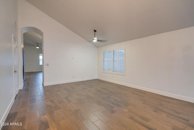 2203 E Crest Ln, Phoenix, AZ 85024 - empty room featuring ceiling fan, arched walkways, dark wood-style flooring, and lofted ceiling