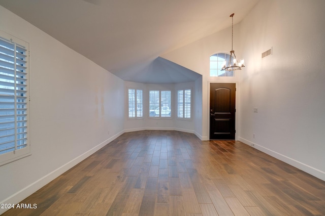 2203 E Crest Ln, Phoenix, AZ 85024 - entrance foyer with a chandelier, vaulted ceiling, and dark wood-type flooring