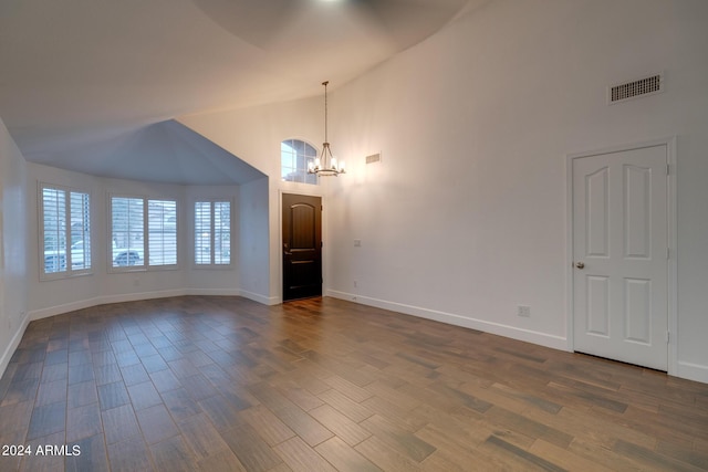 2203 E Crest Ln, Phoenix, AZ 85024 - unfurnished living room featuring a chandelier, high vaulted ceiling, and dark wood finished floors