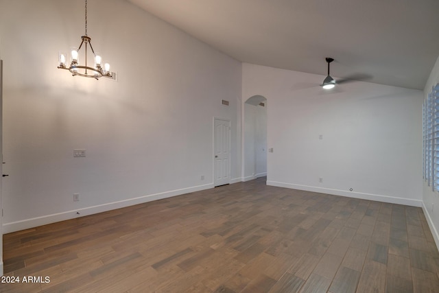 2203 E Crest Ln, Phoenix, AZ 85024 - unfurnished room with high vaulted ceiling, arched walkways, a ceiling fan, a chandelier, and dark wood-style flooring