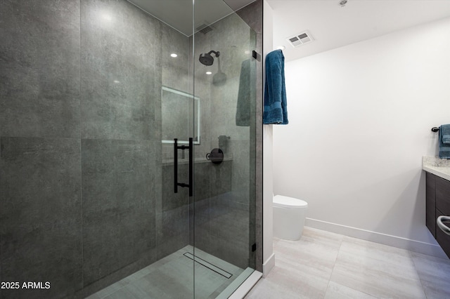 bathroom with vanity, a stall shower, toilet, and visible vents
