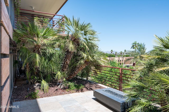 exterior space featuring a patio and an outdoor fire pit