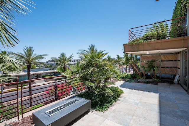 view of patio / terrace with an outdoor fire pit