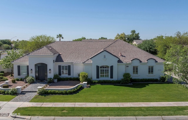 3173 E Page Ave, Gilbert, AZ 85234 - french provincial home with a tiled roof, a front yard, and stucco siding