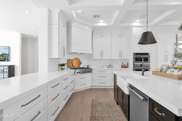 3173 E Page Ave, Gilbert, AZ 85234 - kitchen with wall chimney range hood, white cabinetry, visible vents, appliances with stainless steel finishes, and light countertops