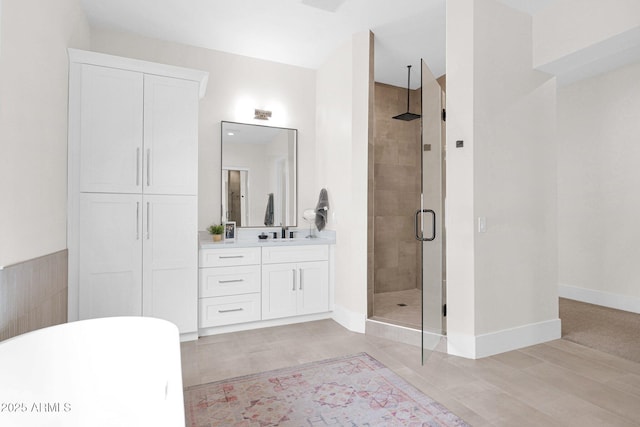 3173 E Page Ave, Gilbert, AZ 85234 - bathroom with vanity, baseboards, a stall shower, tile patterned floors, and a freestanding bath