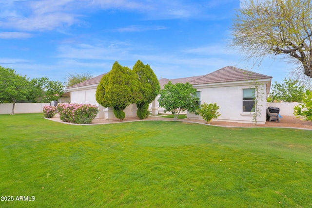 3173 E Page Ave, Gilbert, AZ 85234 - exterior space featuring a yard, a tile roof, fence, and stucco siding