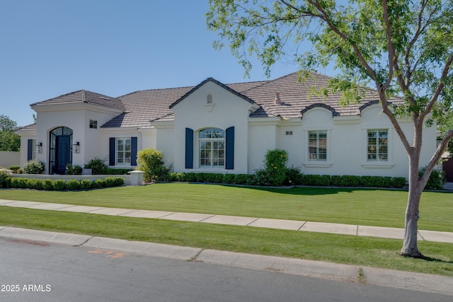 3173 E Page Ave, Gilbert, AZ 85234 - view of front facade with a front lawn, stucco siding, and a tile roof
