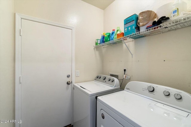 laundry area with separate washer and dryer